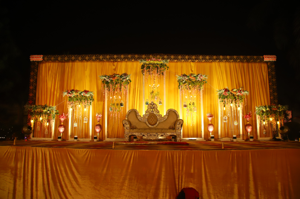 Grand wedding stage with big sofa and flower decoration
